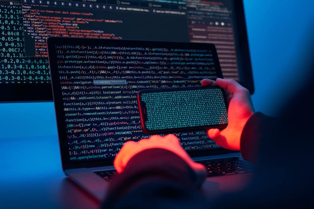 Man using computer and programming to break code. Cyber security threat. Network security